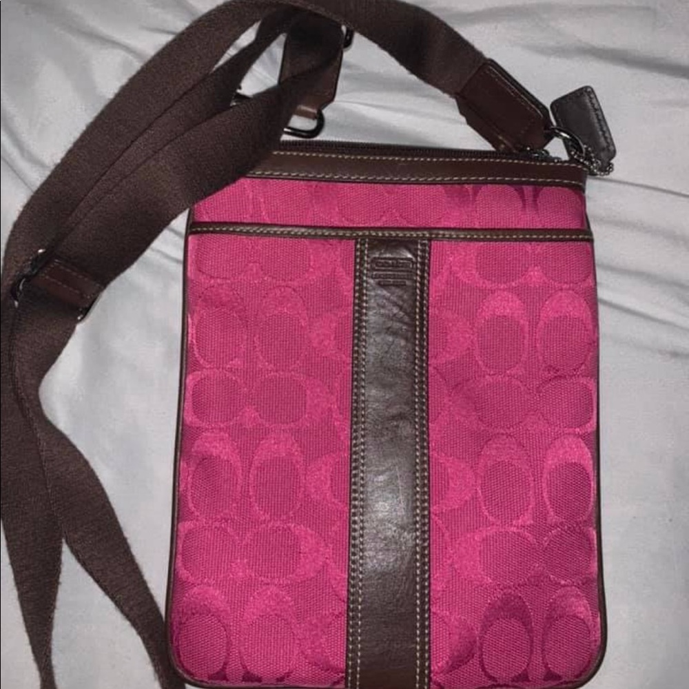 Pink coach crossbody with brown strap